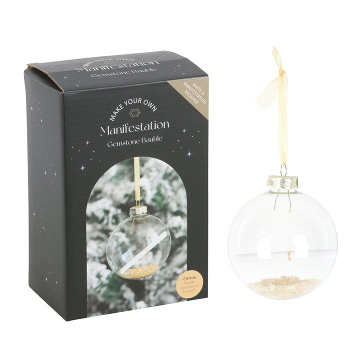 Clear gemstone bauble with packaging labeled 'Make Your Own Manifestation Gemstone Bauble' on a white background.