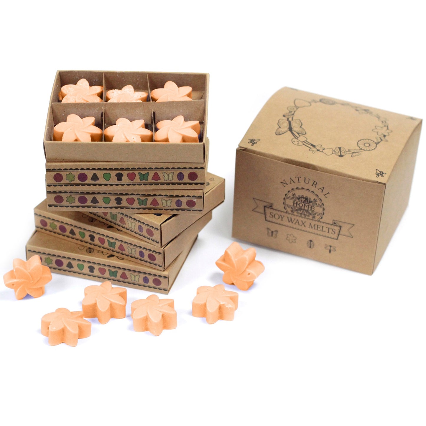 A pack of orange wax tarts in star shapes, displayed alongside their packaging which has 'Natural' and 'Melt' printed on it, indicating the product is a type of fragrance melt.