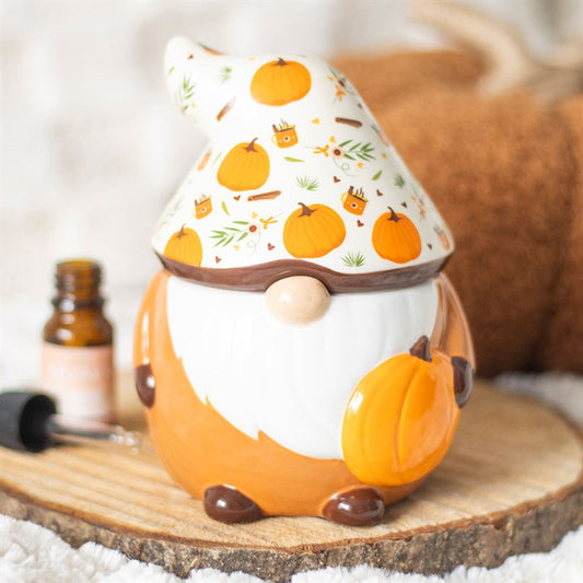 Ceramic oil burner featuring a cute autumn-themed gonk with a cosy hat, perfect for home fragrance in autumn