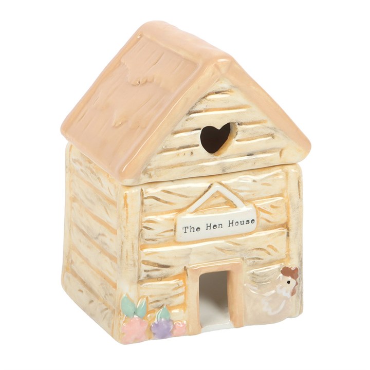 Small ceramic hen house with a heart window on a white background