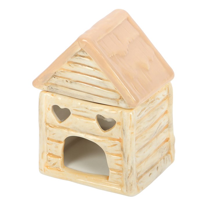 Small house-shaped ceramic lantern with a beige roof and heart designs on a white background