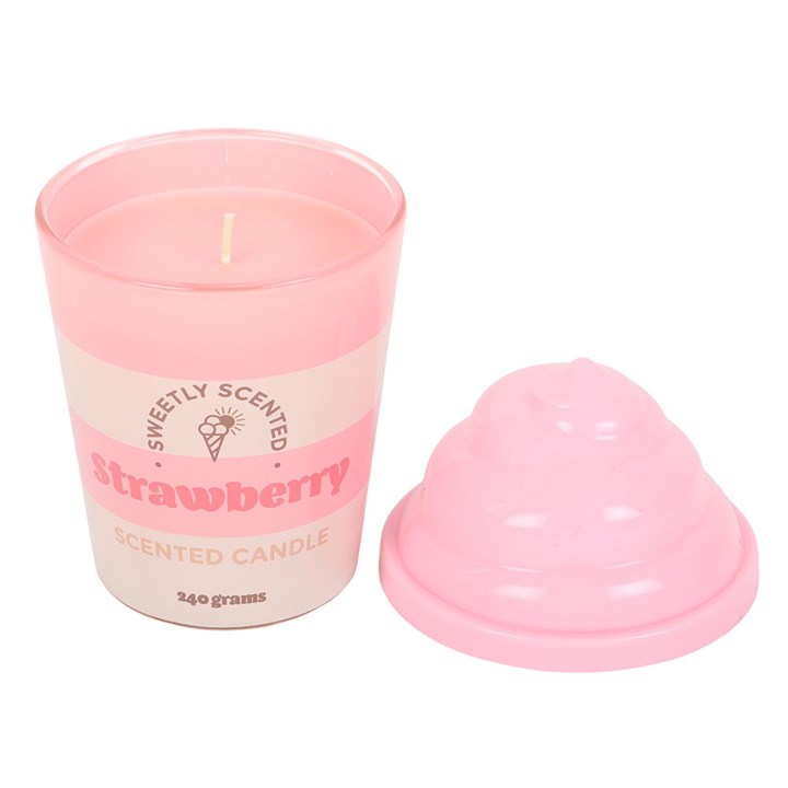 Pink scented candle with a heart-shaped lid on a white background