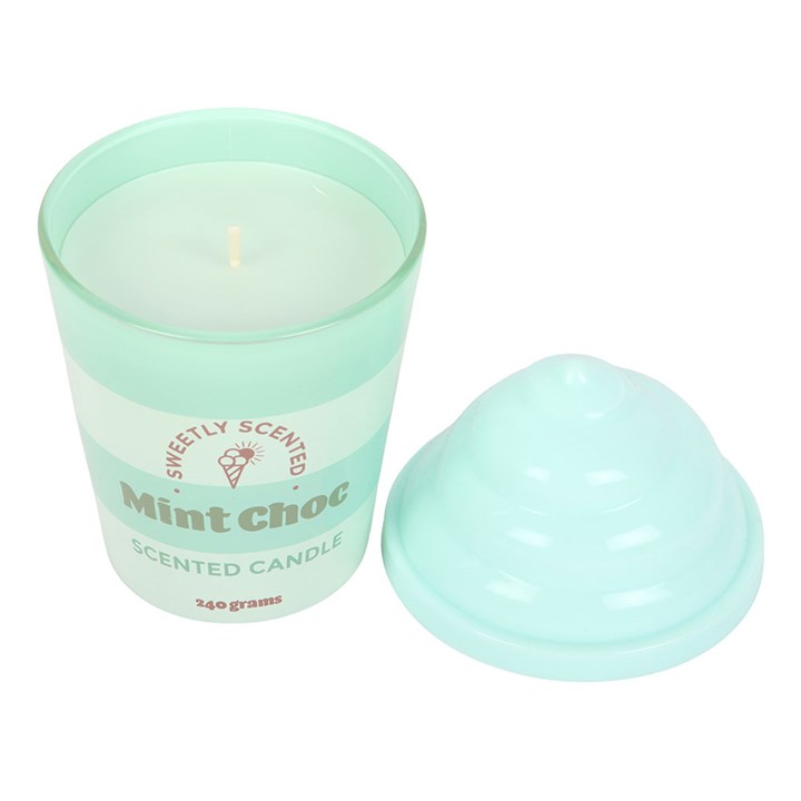 Mint green scented candle with a matching lid on a white background