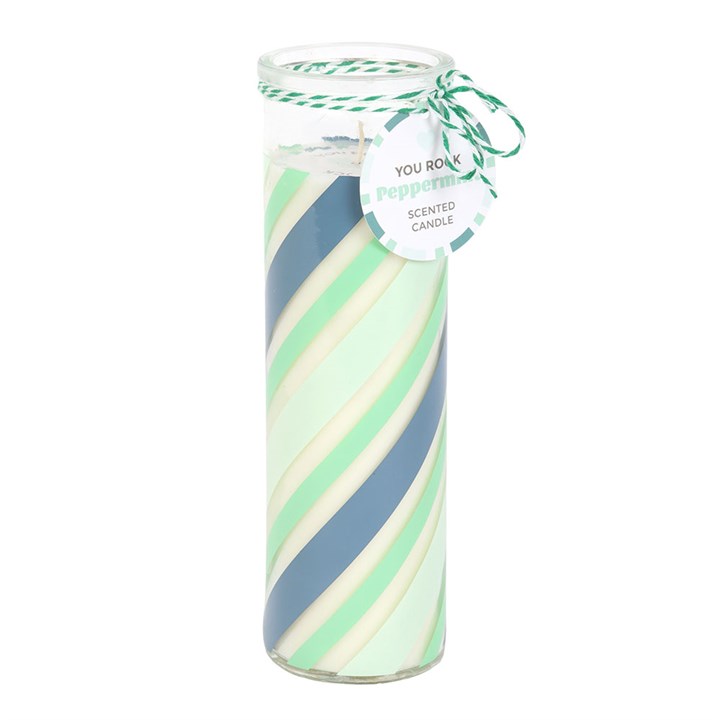 Scented candle with green and blue swirled design on a white background