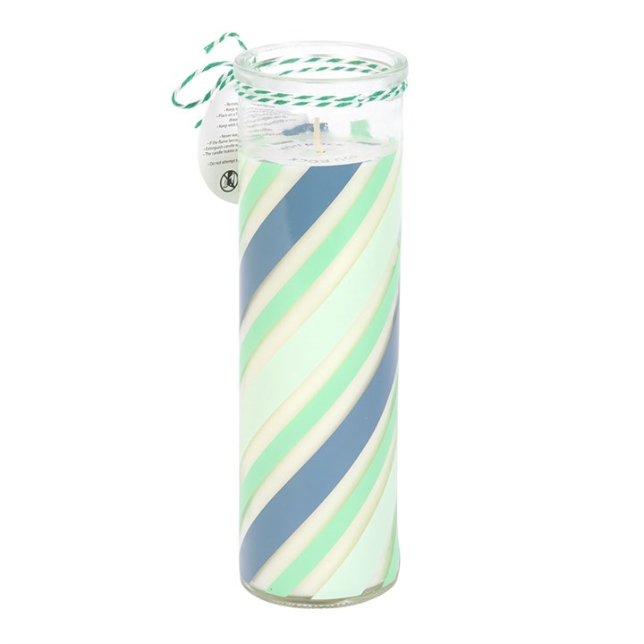 Glass candle holder with green and blue striped design on a white background