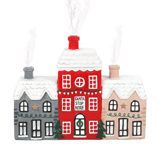 Decorative Christmas village houses with a red house labeled 'Santa Stop Here' on a white background.