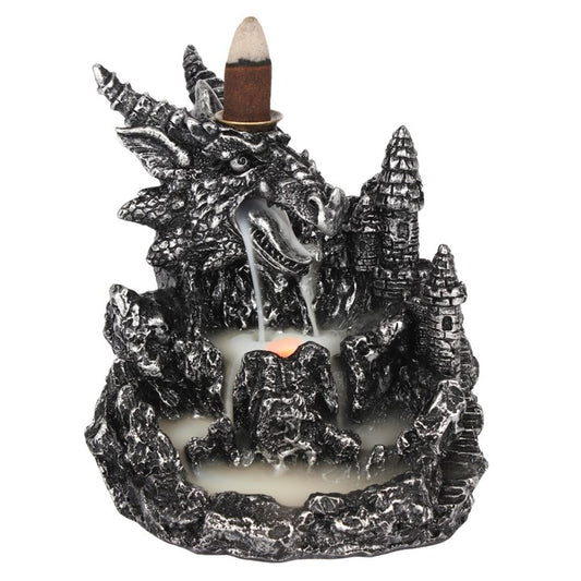 Dragon-shaped incense burner with a castle design on a white background
