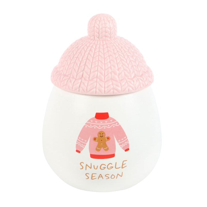 Decorative jar with pink knit lid and 'Snuggle Season' text on a white background