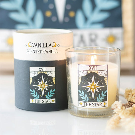 Vanilla scented candle with 'The Star' design and packaging on a blurred background