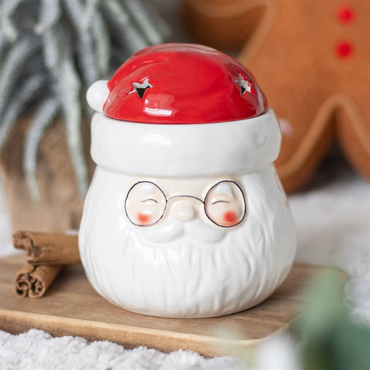 White ceramic jar with a red lid resembling a cartoon character on a wooden surface.