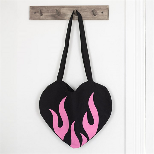 Heart-shaped bag with pink flames hanging on a wooden hook against a white background