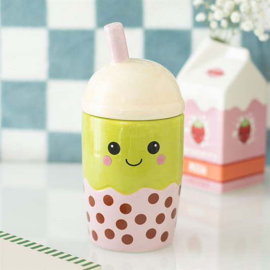 Cute cup with a smiley face design on a checkered background